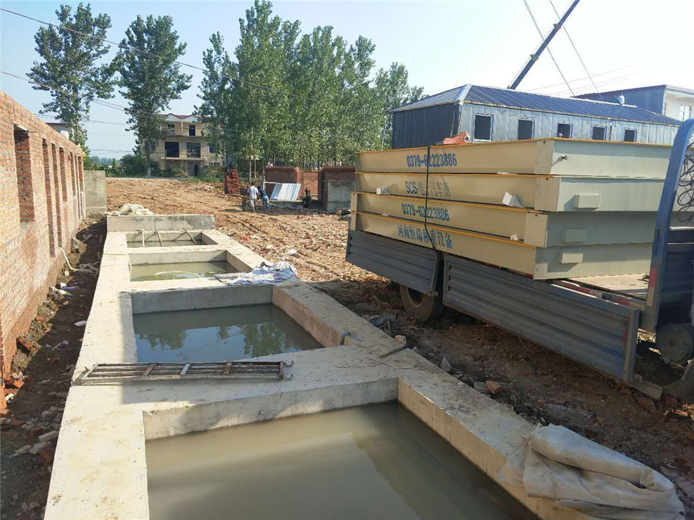 駐馬店新蔡石福建材3x18m-200噸數(shù)字地磅施工案例